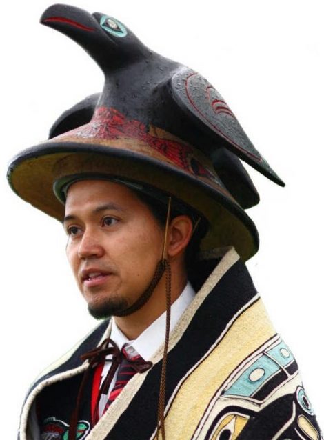 Tlingit man wearing Raven hat